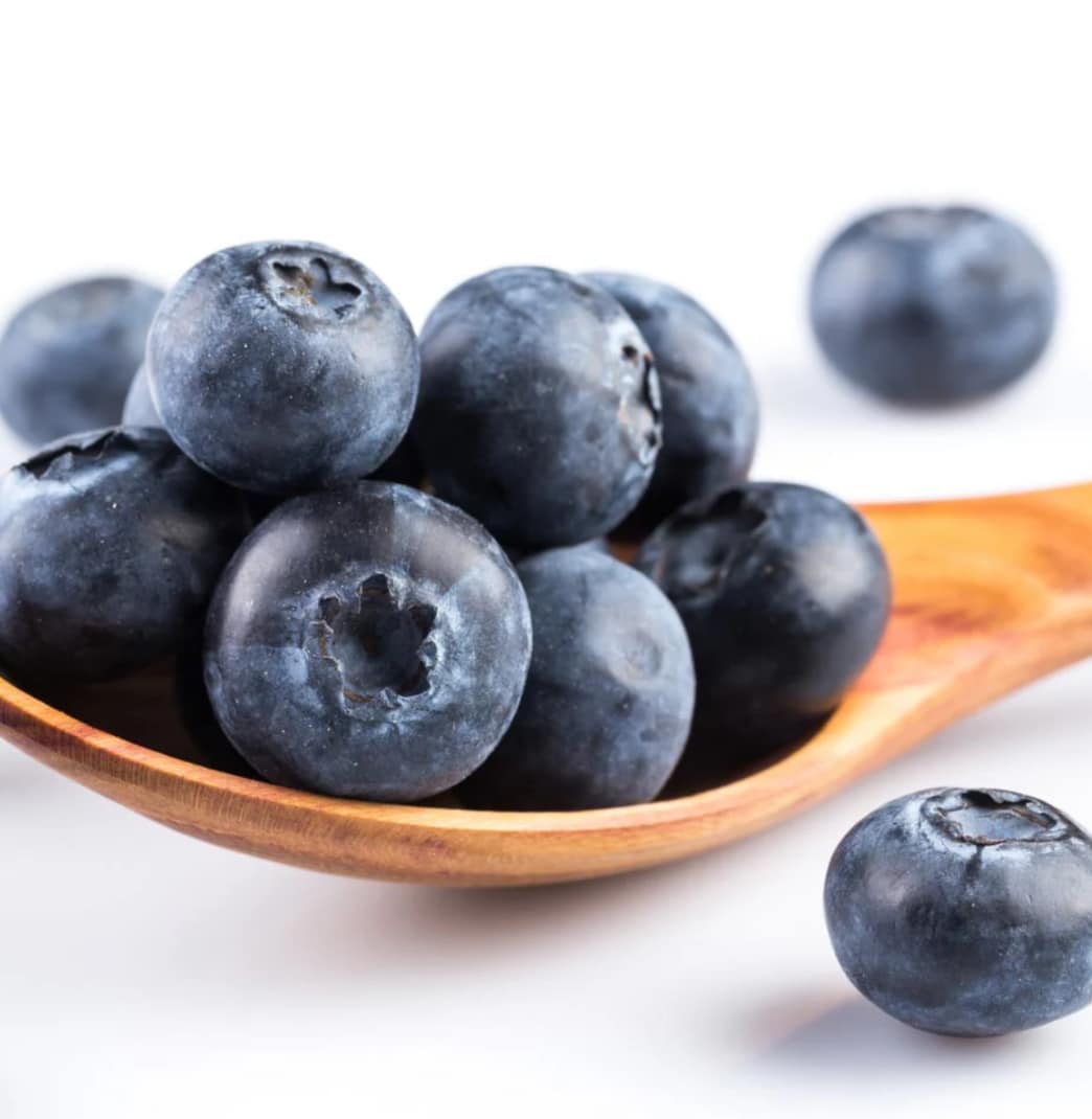 Blueberries in wooden spoon