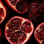 Pomegranate split in half, exposing its seeds